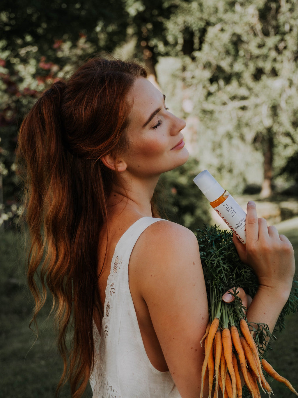 Natural Carrot Dry Oil With Aloe Vera — lifestyle product photography